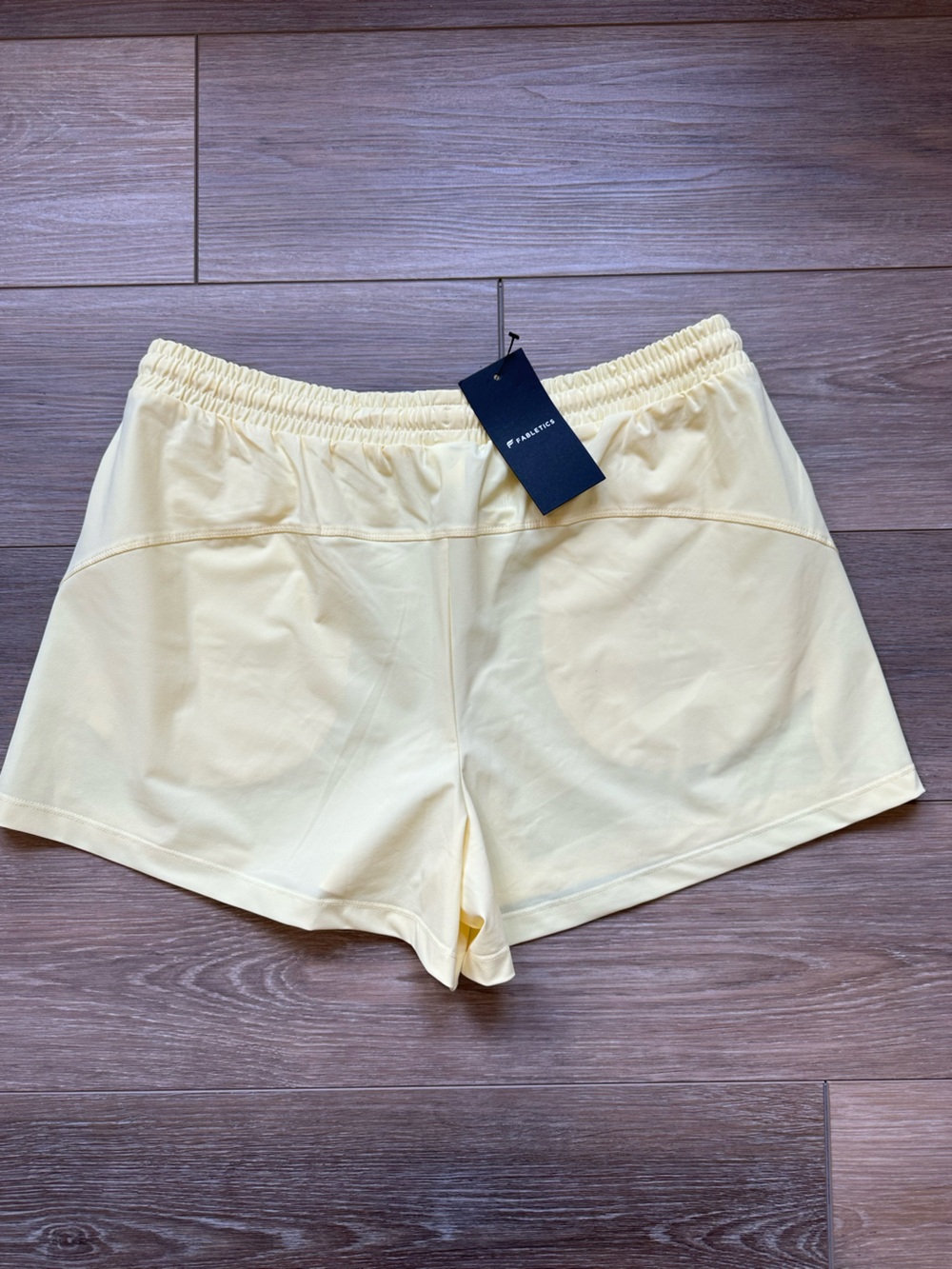 Fabletics Light Yellow Drawstring Active Shorts - Picture 2 of 3